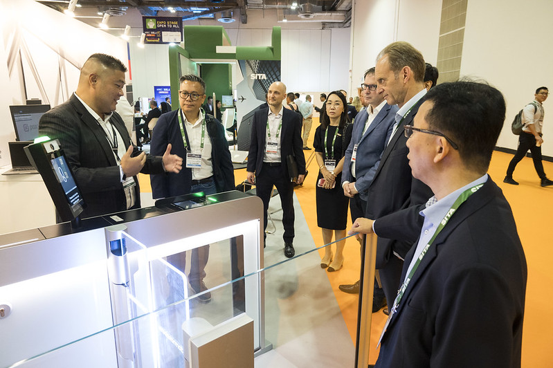 Guided tech tour group discovering airport technology and innovation demos at APEX FTE EXPO Asia