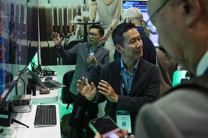Aviation delegates interacting with solution providers on the expo floor tour