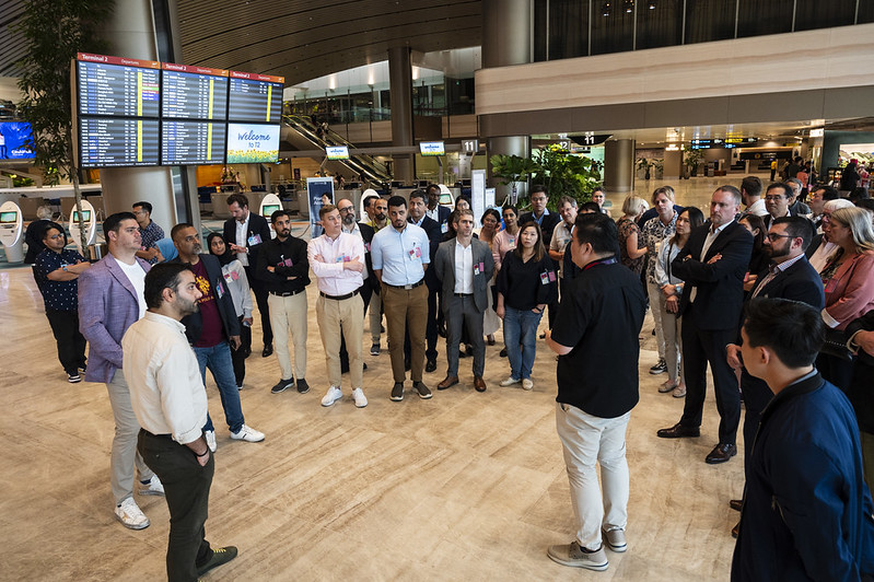 Delegates exploring interactive UI/UX testing lab at Terminal X