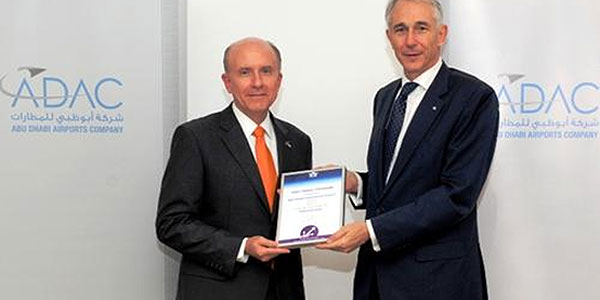 James Bennett, CEO, Abu Dhabi Airports Company, receives the Fast Travel Gold Award from Tony Tyler, IATA CEO.