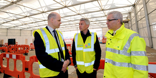 Andy Garner, Director Operational Readiness Heathrow – Olympics and Paralympics 2012; Jonathan Edwards, former Olympic gold medallist; and Norman Boivin, COO, Heathrow Airport at the Games Terminal ‘topping out’ ceremony.