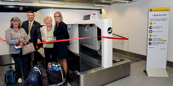 The first passengers to use the new bag drop system helped to cut the ribbon and were rewarded with a seat upgrade and shopping vouchers.