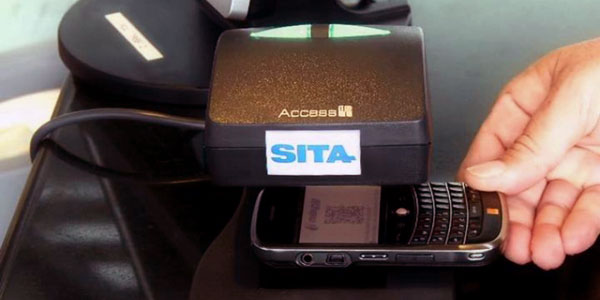 A passenger scanning their mobile phone.