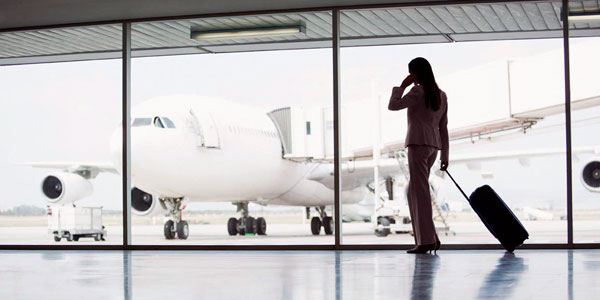 A passenger using her mobile phone in the terminal