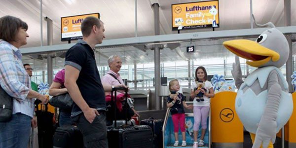 The family check-in desks feature a runway-inspired pathway