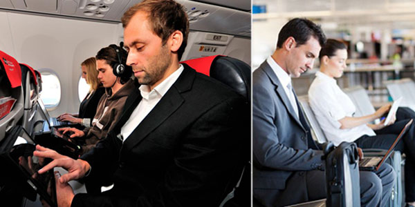 Passengers making use of internet access on the ground and up in the air Passengers making use of internet access on the ground and up in the air