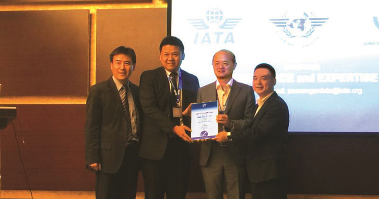 Photograph of Hong Kong Airlines executives holding the Green Certificate