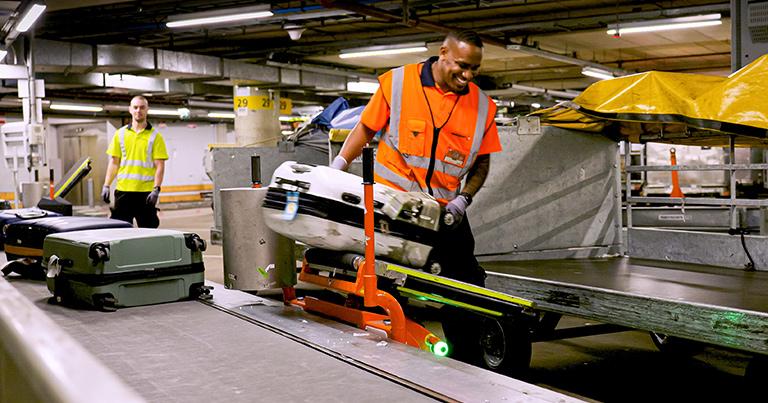 Schiphol introduces lifting aids at every workstation in its baggage halls as it adopts advanced tech